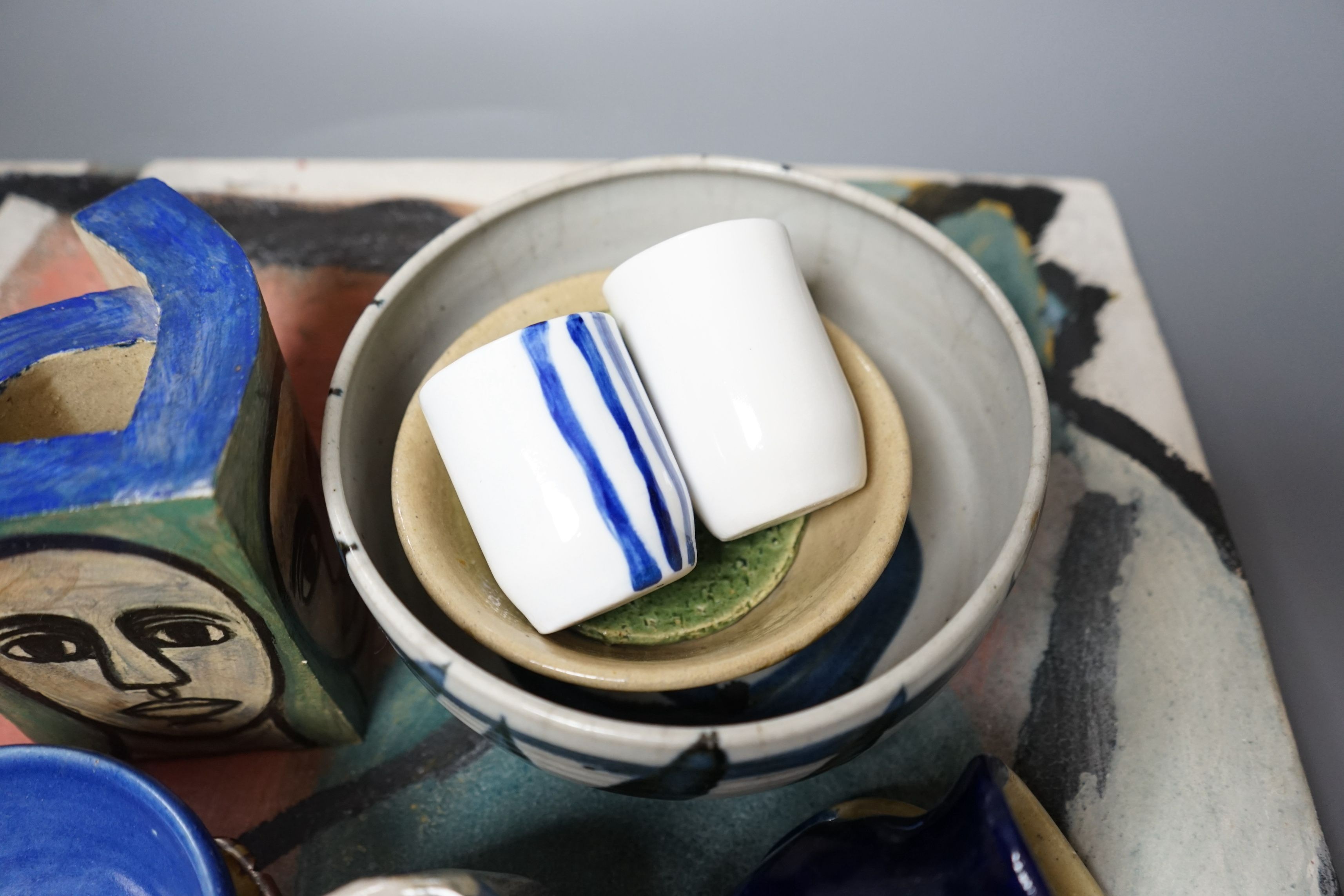 Studio pottery; a large square polychrome platter signed ‘Eastman June 87’ and a geometric vase indistinctly signed and dated 91, together with other various studio pottery wares